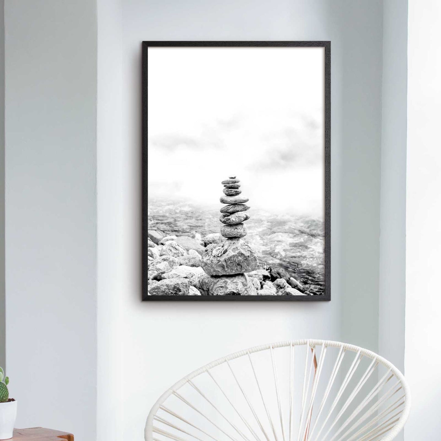 Black and white mindfulness poster with small stone tower